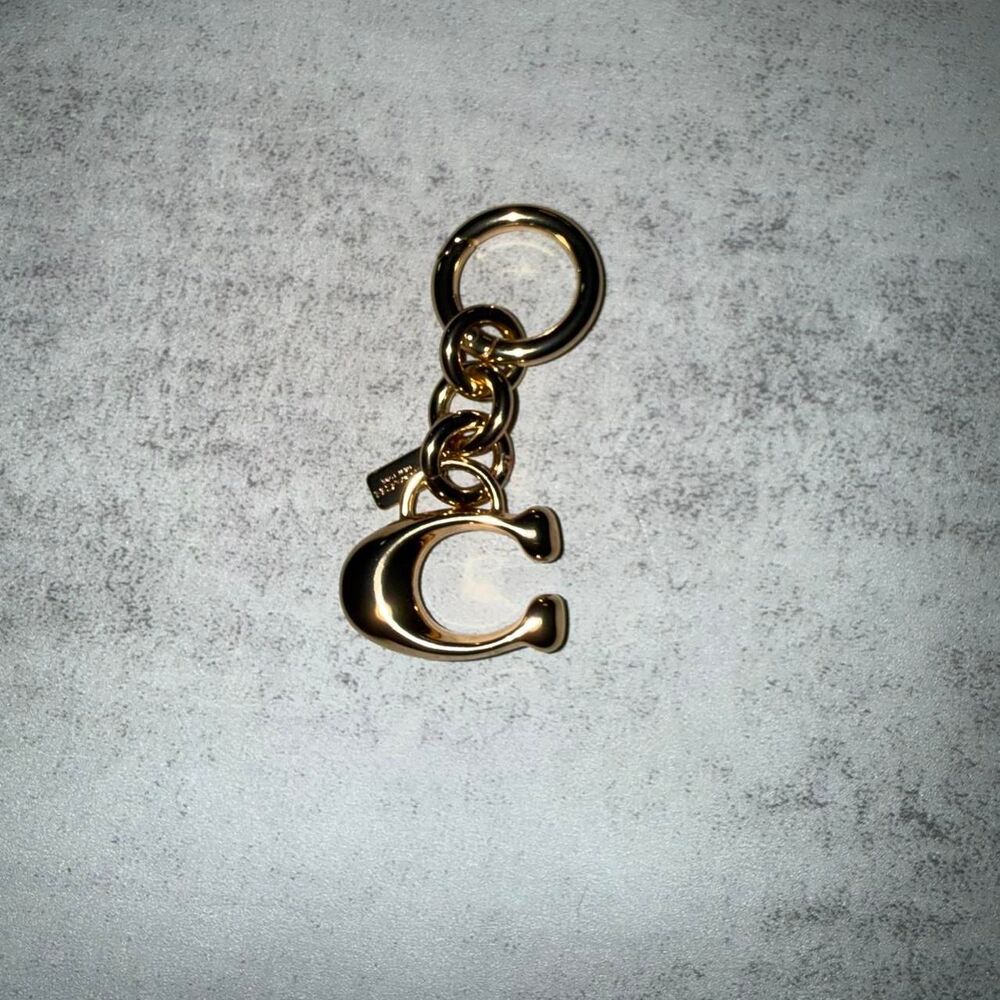 Coach c brass gold charm